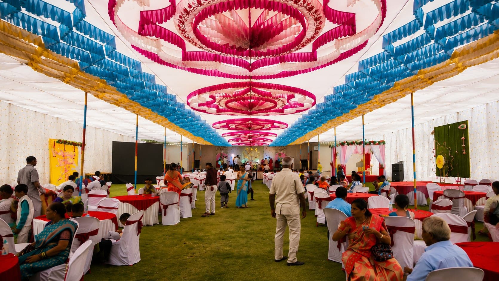 Guests seated under the celebration tent